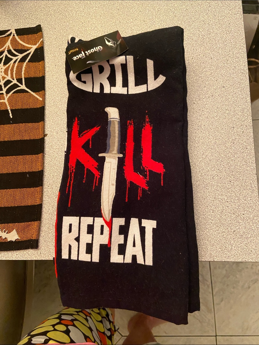 Ghost Face Men’s Black Grill Kill Repeat" dish towel
